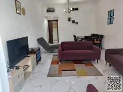 Luxurious two-bedroom apartment with a living room, fully furnished, and featuring a balcony. Ajman,
