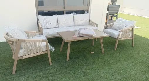 4-piece outdoor lounge set with coffee table — light wood finish, like new