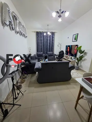 2BR in City Tower, 1154 sqft with parking, AED 195K down, AED 4,600 monthly, total AED 495K.