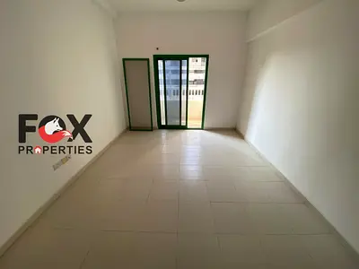 Studio for rent in Smart Tower Al Amerah Ajman, balcony, gym, pool, parking, on Sheikh Mohammed bin Zayed Road, near all services with easy Dubai exit