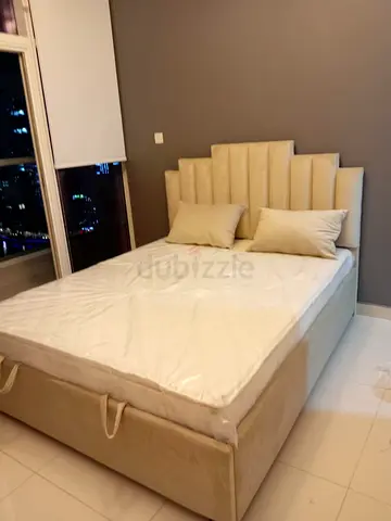 Beige Upholstered Double Bed with Storage and Headboard