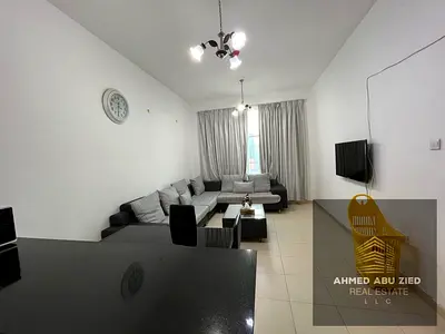 Fully furnished one-bedroom apartment for annual rent in City Towers - Al Nuaimiya 2, featuring high-end finishes, central air conditioning, and a pri