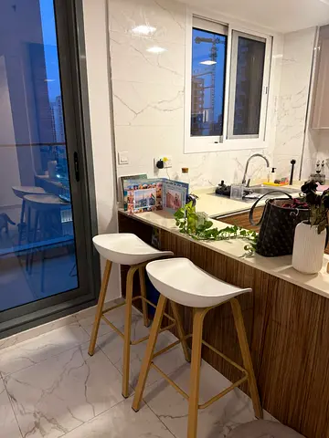 Pair of modern wooden bar stools with white seats