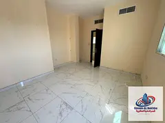 For annual rent in Sharjah, Al Qulaya area: a one-bedroom apartment with a sea view, close to Sharja