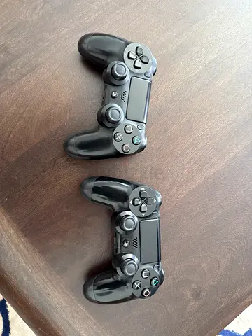 Pair of Black DualShock 4 Controllers (PS4) - Perfectly working