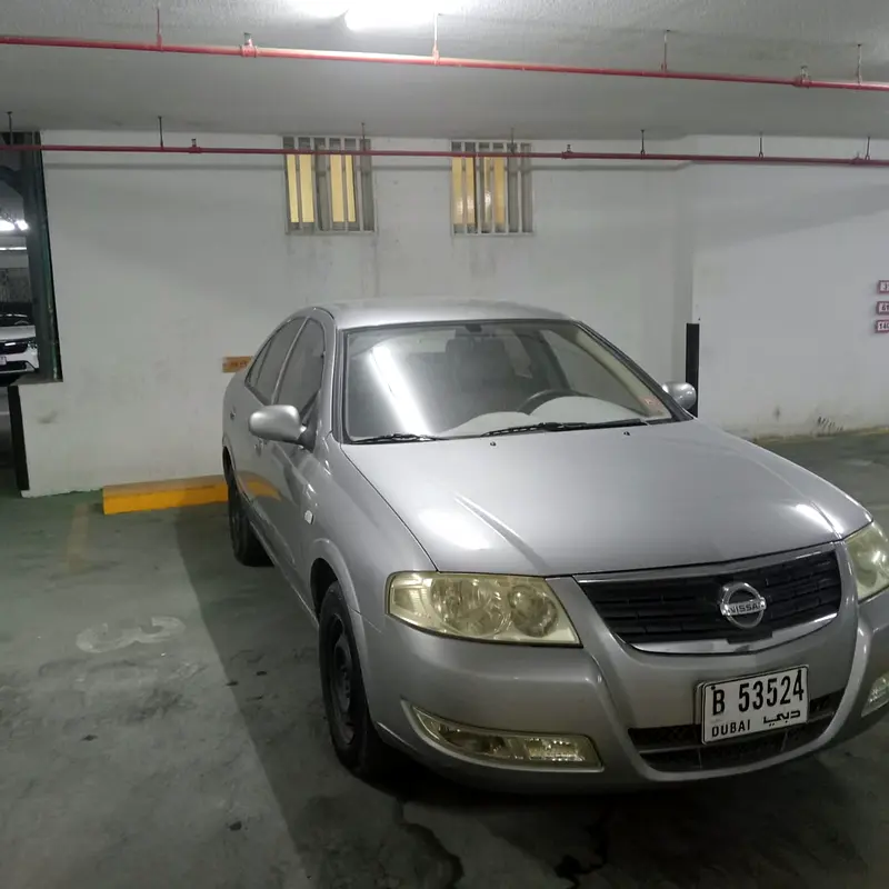 Nissan Sunny 2009 — photo 1 of 3