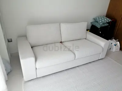 Beige 2-seater fabric sofa in good condition