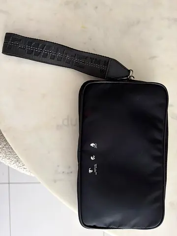 Sleek off-white travel wash bag
