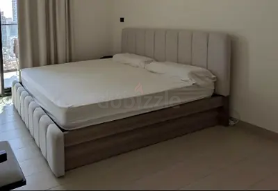 Queen bed frame with upholstered headboard and storage base - light grey