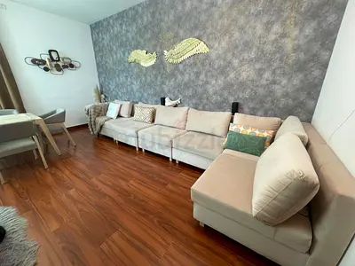 Beige L-shaped Modular Sofa with Ottoman - Good Condition