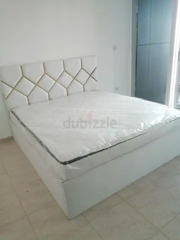 Brand New White Upholstered king size Bed with Mattress