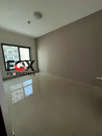 Room and living room for annual rent in Ajman, in the Emirates City, first tenant, new building, balcony, 2 bathrooms, spacious areas