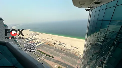 Furnished 2BR for sale in Corniche Residence Ajman, full sea view, 100% freehold, prime location near services, easy Sharjah access.