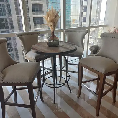 THE ONE Round wooden bistro table with 4 upholstered dining high stools — set of 5