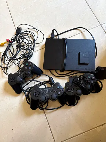 Sony PlayStation 2 Slim with 2 wiredControllers,1 wireless controller and cables with Game disks