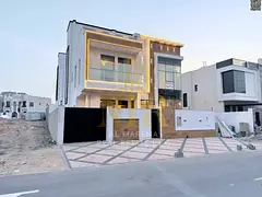 Luxury villa in the heart of Ajman, two floors and a roof, price includes registration and ownership