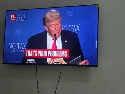 Samsung 55-inch LED TV mounted on wall — flawless condition- under warranty