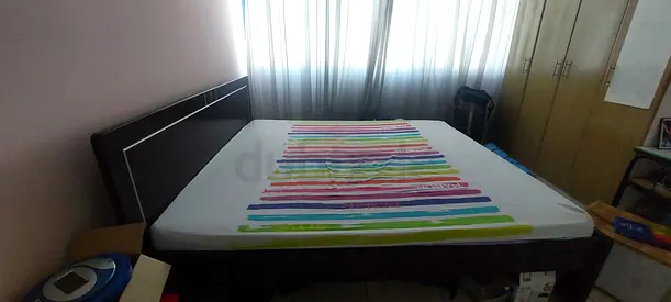 King bed frame with mattress — solid wooden headboard, good condition