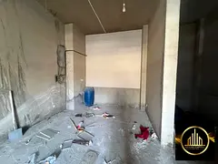 Store for annual rent in Al Rashidiya 1, suitable for any business or warehouse only.