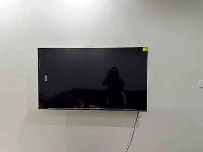 55-inch LED Smart TV (used, wall-mounted) - Good working condition