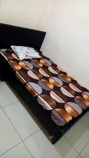 Small Furnished Room attached bath available for Executive with window opposite RAK Bank Al Qusais