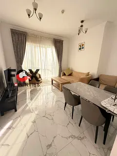 Elegant furnished 1BR apartment for annual rent, spacious layout, 2 bathrooms, balcony, prime locati