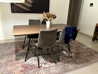 Wooden Dining Table with 4 Chairs and Decorative Rug - Good Condition