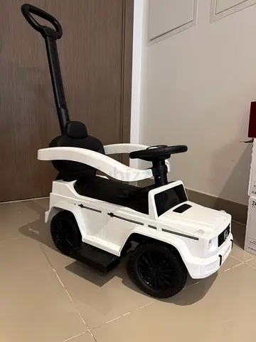 White ride-on push car with parental push handle