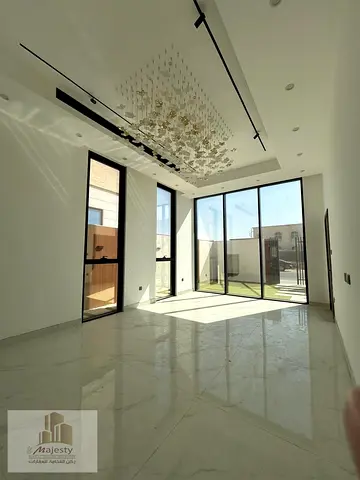 Luxury villa for sale in Al Suyouh Al Raqeeba, Sharjah, next to Nesma and Masar, 5000 sq ft with a private pool and outdoor seating, elegant design