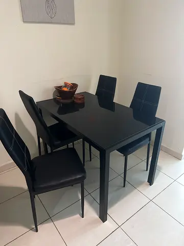 Black 4-Seater Dining Table with Upholstered Chairs