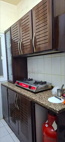 Compact aluminium kitchen cabinet set with granite countertop, used