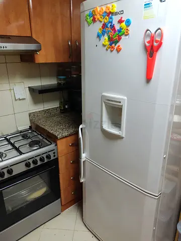 Well-kept White Refrigerator with Freezer - Perfect for Home Use