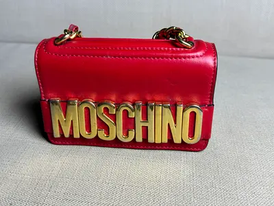 Moschino balloon lettering crossbody bag in red.