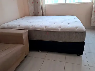 Queen mattress with divan base - good condition.