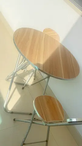 Small round folding bistro table with two matching stools