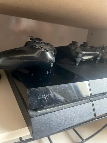 (very NEGOTIABLE) Sony PlayStation 4 console with 2 controllers - lightly used. need gone fast