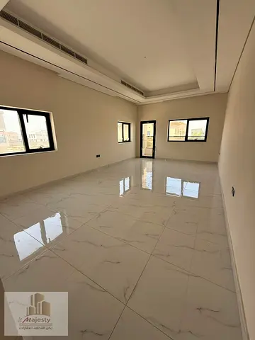 For sale, a villa in the Emirate of Sharjah, Al-Hoshi area, featuring a modern design, high-end finishes, and large spaces. The villa has an elevator