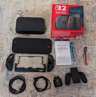 Nintendo switch 2 like new with screen protector and protective guard