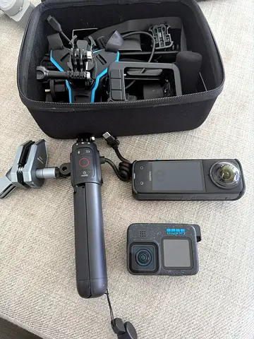 GoPro Hero + Insta360 One X2 bundle with tripod grip and carrying case