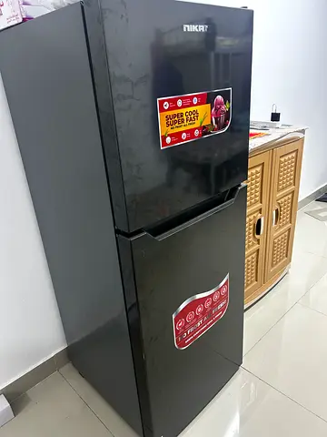 Used two-door top freezer refrigerator - good working condition and washing machine