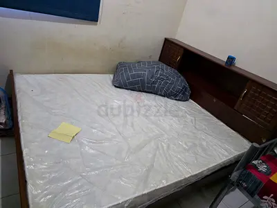 Wooden double bed with headboard storage - used