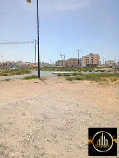 A plot of land with a building permit for a ground floor and 10 floors, located next to Al Amer Vill