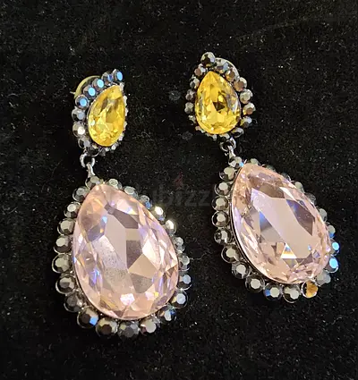 Pair of drop dangle earrings with pink and yellow teardrop crystals