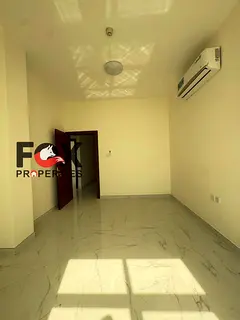 Brand new apartment, two bedrooms and a living room in Al Rawda area, with a balcony and three bathr