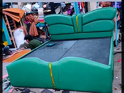 Green Upholstered Double Bed with Padded Headboard and Storage Base