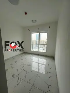 1 bedroom hall for rent in Al Waha Towers Ajman with parking gym and swimming pool AED yearly 6 paym