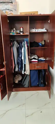 Used 3-Door Wooden Wardrobe with Shelves and Hanging Rail - Good Condition
