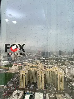 One-bedroom apartment with a living room for annual rent at Al Waha Towers in Al Rashidiya 1 area, f