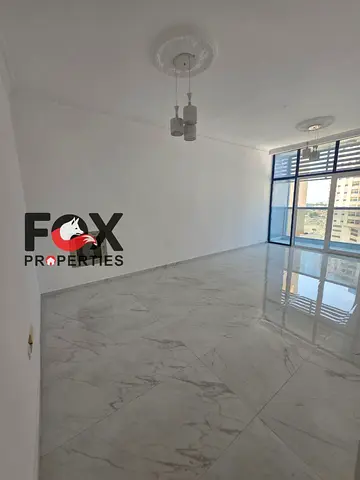 1BR in Nuaimiya 3, free parking, good finish. AED 38,000 in 4–5 payments, deposit cheque. Prime location near services.