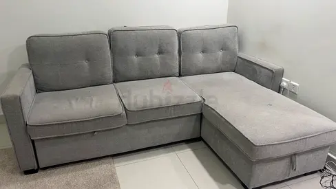 Light grey storage sofa bed with under-seat storage - good condition. Size(210/84)